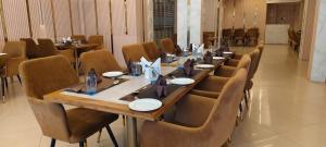 a conference room with a long table and chairs at Hotel citypalace in Trivandrum