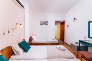 Postel nebo postele na pokoji v ubytování Eva Marina Hotel