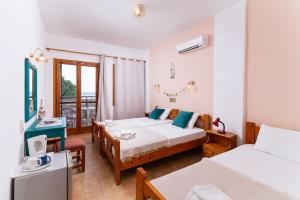 Postel nebo postele na pokoji v ubytování Eva Marina Hotel
