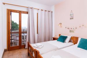 Postel nebo postele na pokoji v ubytování Eva Marina Hotel