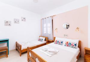 Postel nebo postele na pokoji v ubytování Eva Marina Hotel