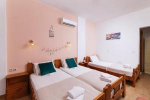Postel nebo postele na pokoji v ubytování Eva Marina Hotel