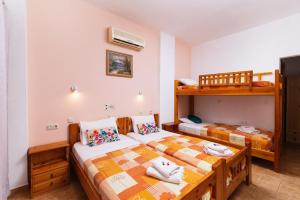 Postel nebo postele na pokoji v ubytování Eva Marina Hotel