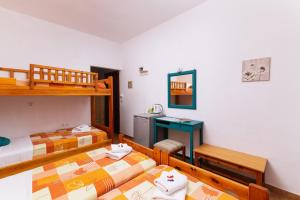 Postel nebo postele na pokoji v ubytování Eva Marina Hotel