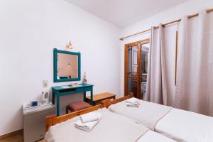 Postel nebo postele na pokoji v ubytování Eva Marina Hotel