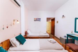 Postel nebo postele na pokoji v ubytování Eva Marina Hotel