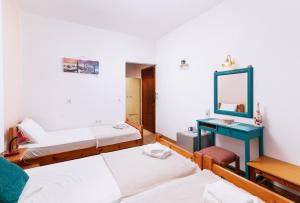 Postel nebo postele na pokoji v ubytování Eva Marina Hotel