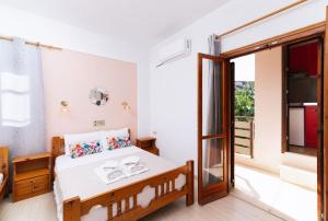 Postel nebo postele na pokoji v ubytování Eva Marina Hotel