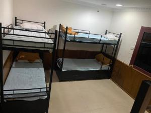 Postel nebo postele na pokoji v ubytování Hotel RJ INN