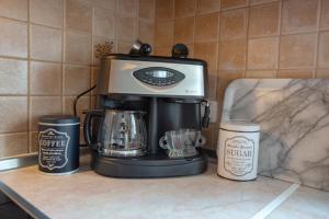 a coffee maker sitting on top of a counter at Azure Bay Villa by RentalsPro - Neos Marmaras Halkidiki in Paradisos