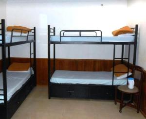 Postel nebo postele na pokoji v ubytování Hotel RJ INN