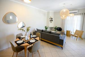 a living room with a couch and a table at Ml House in Tsoukaladhes