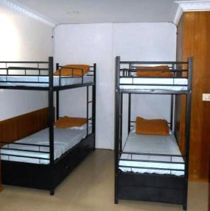 Postel nebo postele na pokoji v ubytování Hotel RJ INN