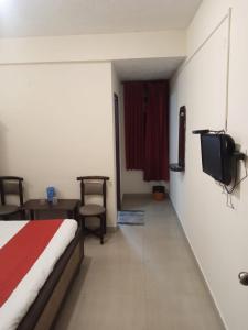 Postel nebo postele na pokoji v ubytování Hotel RJ INN