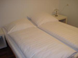 Ένα ή περισσότερα κρεβάτια σε δωμάτιο στο Hotel Gregory