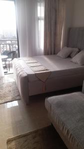 a bedroom with two beds and a window with a view at A cozy studio apartment in Ruaka