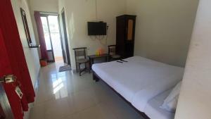 Postel nebo postele na pokoji v ubytování Hotel RJ INN