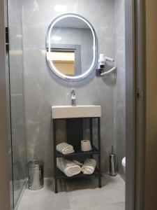Koupelna v ubytování Optimal Hotel