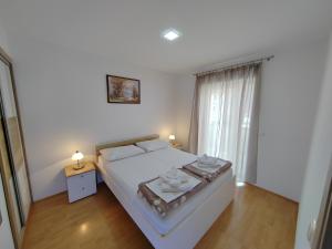 Postel nebo postele na pokoji v ubytování Apartments Hrgovcic