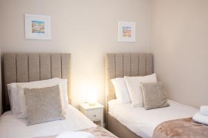 En eller flere senge i et værelse på Northern Hideaways Shore Cottage, Beadnell + 69 billeder