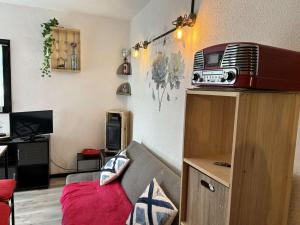 a small living room with a couch and a room with at SP570-A101 Appartement 2 pièces - balcon - parking - Saint Pierre la mer in Saint Pierre La Mer