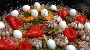 a pan filled with food with tomatoes and eggs at Yurt Glamping Edelweiss Meadow at the foot of Lenin Peak in Sary-Mogul