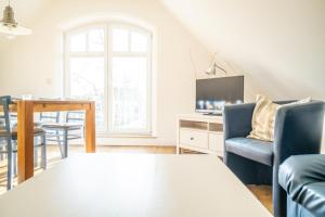 TV a/nebo společenská místnost v ubytování Haus Alte Bäckerei - Boddenblick