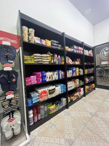 a grocery store aisle with shelves of food at Flat Amarilis em Riviera São Lourenço - com arrumação, café manhã, wifi privat, toalhas praia e piscina e enxoval completo com trocas toalhas in Riviera de São Lourenço +28 photos