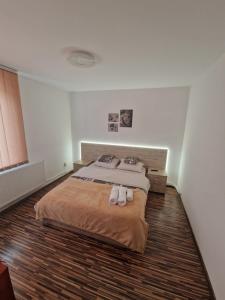 Giường trong phòng chung tại Central Park Aparthotel Turda