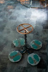 a metal object sitting in a puddle of water at M&V Resort Camping in Langrune-sur-Mer