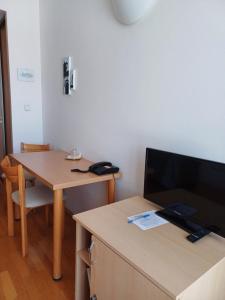 TV a/nebo společenská místnost v ubytování Centrum Mariapoli
