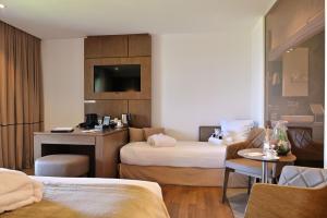 Posezení v ubytování Hôtel Le Week end