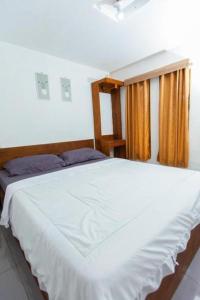 Postel nebo postele na pokoji v ubytování Tastura Homestay