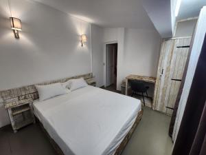 Postel nebo postele na pokoji v ubytování The Cosy Suite