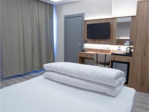 Postel nebo postele na pokoji v ubytování Optimal Hotel