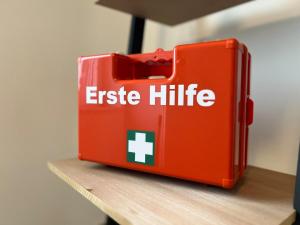 a red briefcase sitting on top of a table at City Apartment 2 in Euskirchen