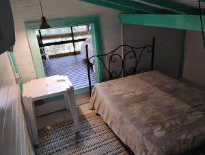 Giường trong phòng chung tại casa entre praias