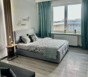 Posteľ alebo postele v izbe v ubytovaní Exclusive Apartments Smolna