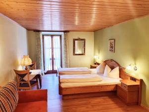 Postel nebo postele na pokoji v ubytování Hotel Altwirt