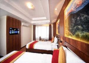 Letto o letti in una camera di Hotel Friends Home