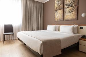 Postel nebo postele na pokoji v ubytování Best Western Plus Congress Hotel Yerevan