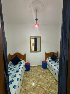 Postel nebo postele na pokoji v ubytování Zohra chic