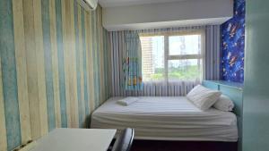 Trivium Terrace Apartment Lippo Cikarang EJIP -Min Stay 3 Nights-客房内的一张或多张床位