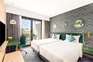 Voodi või voodid majutusasutuse ibis Styles Mysuru toas