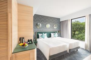 Voodi või voodid majutusasutuse ibis Styles Mysuru toas