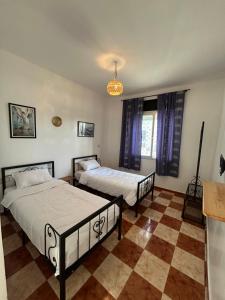 Postel nebo postele na pokoji v ubytování Hotel Al Manar