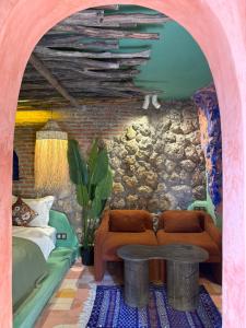 a living room with a couch and a table at Casa Amina in Chefchaouene