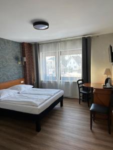 Postel nebo postele na pokoji v ubytování Hotel Pirol