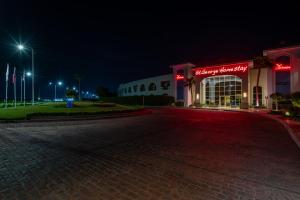 an empty street in front of a store at night at Xperience St. George Sharm El Sheikh in Sharm El Sheikh