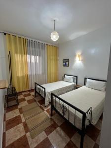 Postel nebo postele na pokoji v ubytování Hotel Al Manar